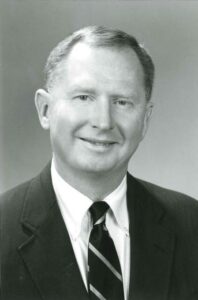 Professional headshot of young Douglas Houser, for Douglas Houser obituary.